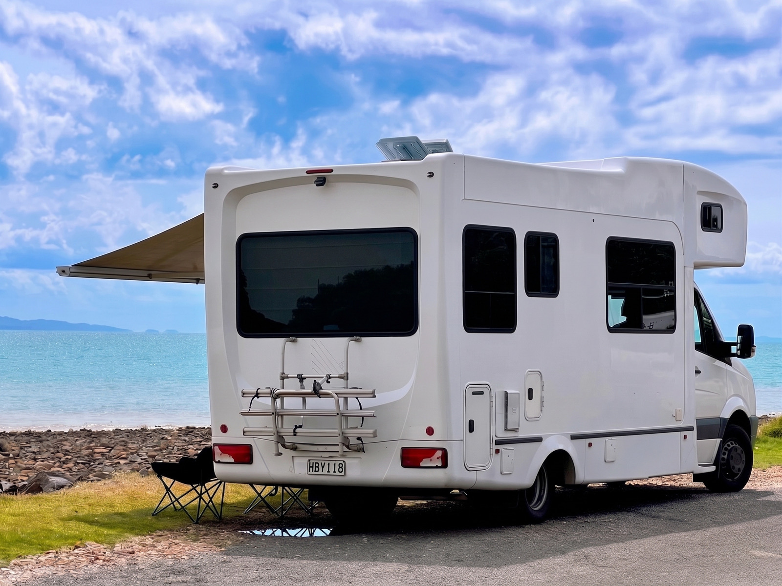 Rear view of Hey Buddy parked beside the New Zealand coast